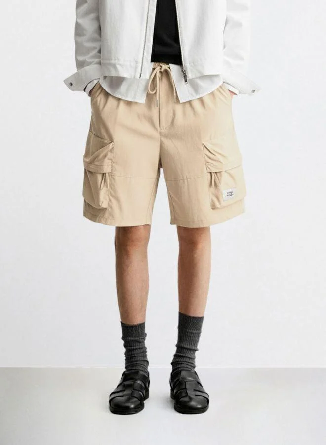 The Indian Garage Co Men Relaxed Fit Solid Cargo Pocket Mid-Rise Cargo Shorts